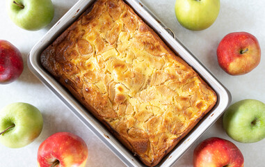 Fresh baked apple pie with sour cream topping in a baking pan