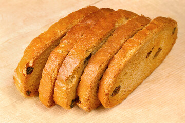 Sweet crackers with raisins on a wooden board.