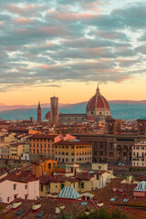 Fototapeta na wymiar Panoramic view of Florence from Piazzale Michelangelo at sunrise. Cathedral of Santa Maria del Fiore and the streets of an ancient Italian city.