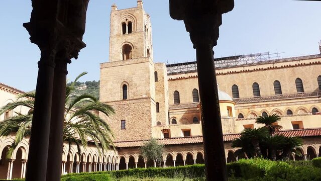 Palermo, ancient Monreale Cathedral cloister, courtyard columns, in summer. Medieval byzantine cloister. Monreale, Palermo, Italy