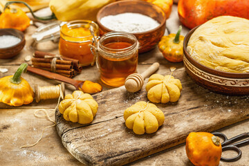 Pumpkin buns or biscuits, traditional fall baked goods. Seasonal ingredients for cooking food