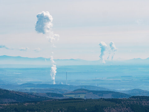 Smoking coal-fired power plant and steam cloud above. North East of Czechia