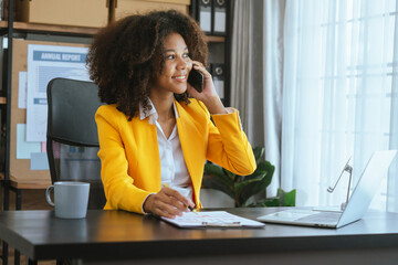 Obraz premium Working smart, African american business woman working audit balance sheet, job order costing, revenue recognition, break-even analysis, appropriated retained earnings, earned surplus, capital gain