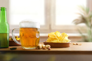 Snack on bench with beer mug and window in background