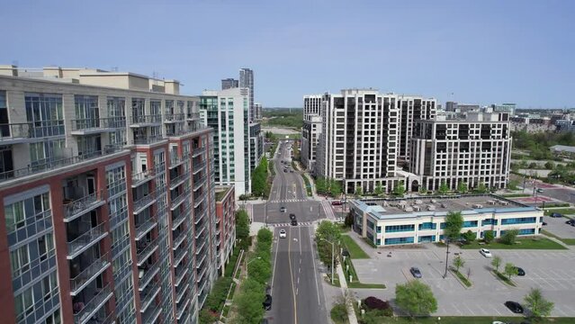 Forward along City of Markham condominium rooftops toward intersection with car traffic at Clegg Road and South Town Centre Boulevard
