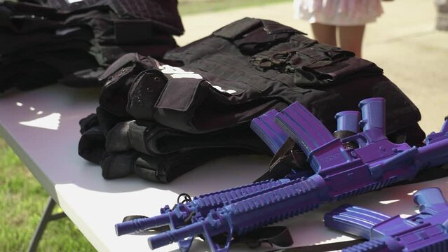 Military training weapons and safety uniforms.