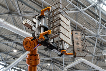Automated robotic technological manipulator loader at the factory