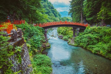 Fototapeta na wymiar Scenic view of the Shinkyo bridge surrounded by trees and vegetation