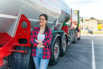 A young woman poses in front of her first cargo truck before embarking on a cross-country tour