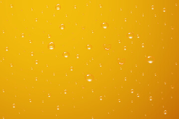 Obraz na płótnie Canvas Background of water drops on some surface in yellow