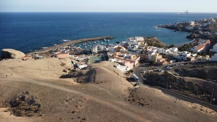 Drone shot of San Miguel de Tajao town with fishing port in Tenerife, Canary Islands