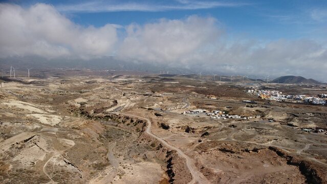 Aerial view of clouds rolling over lowland of Tenerife, Canary Islands in Spain