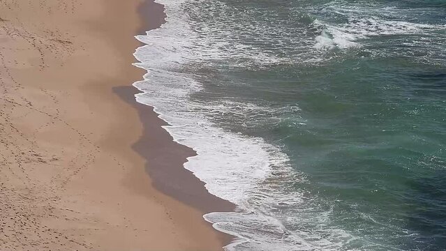 Drone shot of Wave movement on the beach