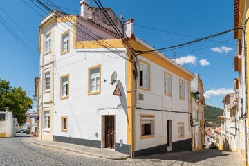 Fototapeta na wymiar Beautiful building painted in white and yellow in the historic area of the city of Portalegre