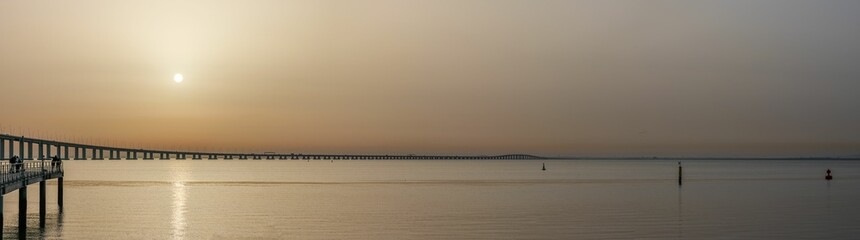 Fototapeta premium Beautiful panoramic landscape at sunrise on the Tagus river in Lisbon, Portugal