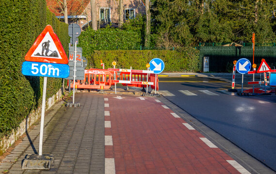 Road repair with road signs. Repair on the bike path