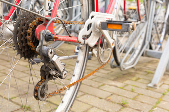 Old bicycle with a rusty chain and system