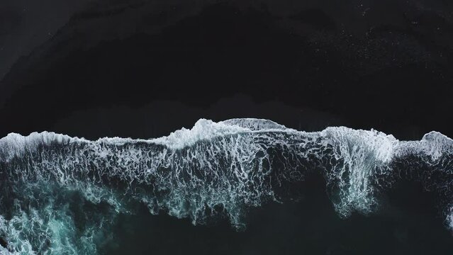 Aerial view of sea waves breaking beach