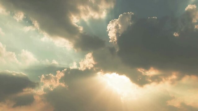 Time-lapse of the sunset in the clouded sky