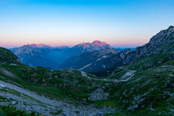 Julian Alps mountain Mangart from Mangrt saddle, Slovenia's Highest Panoramic Road, peak hidden in fog