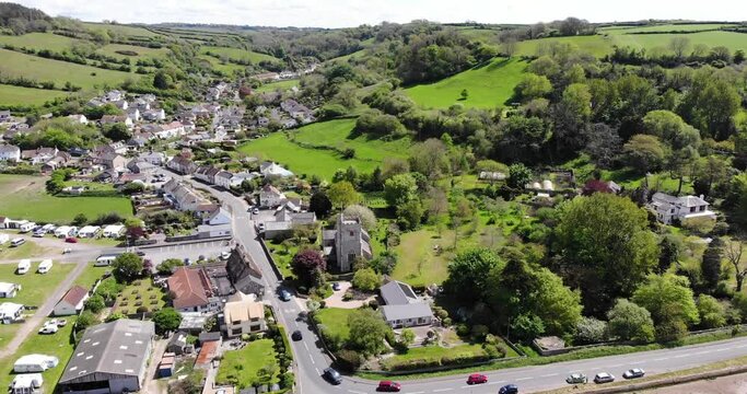 Aerial View Of Scenic Coastal Seaton Village On Sunny Day. Ascending Shot