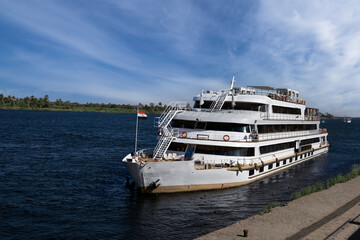 Fototapeta na wymiar Cruising down the Nile in a River Cruise Ship. Egypt . Travel Concept.
