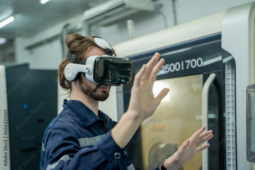 Poster Engineer are using virtual AR to maintain and check the work of CNC machine in the 4.0 smart factory.