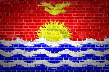 The Kiribati flag painted on a brick wall in an urban location