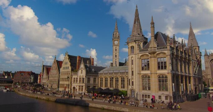 Wide shot of the city of Gent. Famous the cities landscape and historic landmarks. Establishing shot of old houses, streets and river in the city of Ghent on a sunny day, Belgium