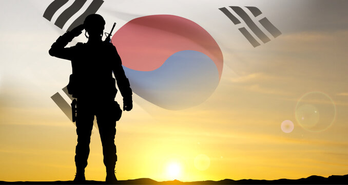 Silhouette of a soldier on background of sunset and flag of South Korea. EPS10 vector