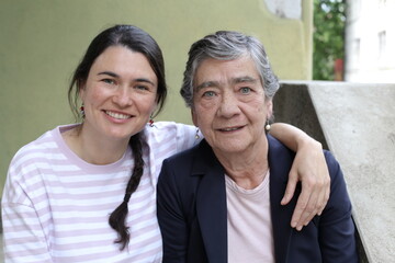 Mother and daughter smiling together 