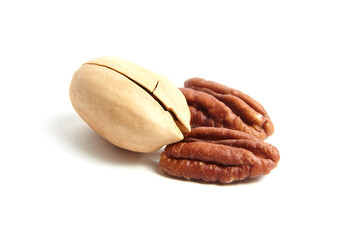 Pecan nut in shell and peeled pecan seeds isolated on a white. Whole and halves of pecan nut