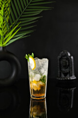 Drink on Black Deep Background with Leaf Decoration