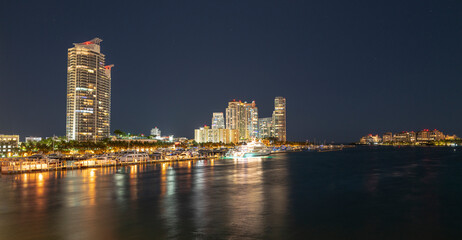 Fototapeta na wymiar Night panoramic photo of Miami landscape. Miami Downtown behind MacArthur Causeway shot from Venetian Causeway.