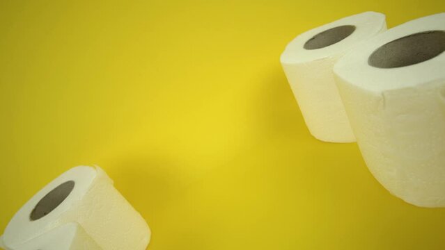 Toilet paper in row on blue background