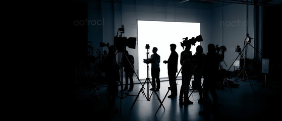 Silhouette images of film production, behind the scenes or b-roll of making video commercial movie, Film crew light man and cameraman working together with film director in studio, Film industry, - obrazy, fototapety, plakaty