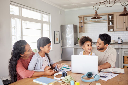 Online school, laptop and parents with their children in the dining room of their family house. Technology, distance learning and kid students working on homework with their mother and father at home