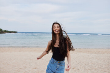Fototapeta na wymiar woman smile beautiful young travel running sea summer lifestyle beach sunset
