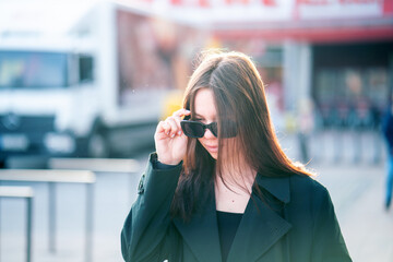 young girl with long hair dressing sunglasses