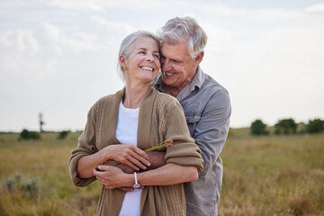 Love, hug and smile with old couple in nature for bonding, happy and romance. Happiness, retirement and support with senior man and woman in countryside for affectionate, holiday and vacation - Powered by Adobe
