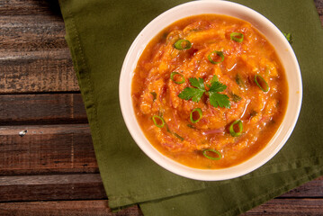 Homemade pumpkin cream, accompanied by spices. pumpkin broth