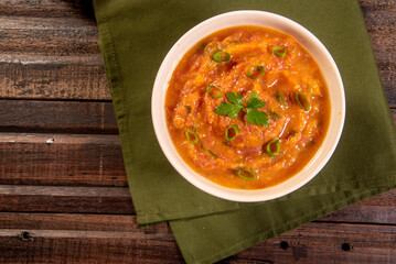 Homemade pumpkin cream, accompanied by spices. pumpkin broth