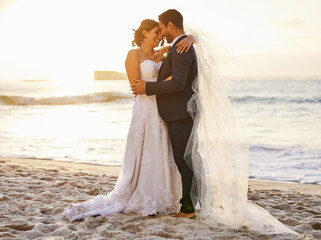Beach, wedding and couple hug at ocean for love, union and celebration against a nature background....