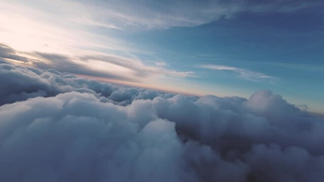 Aerial view Smoothly flying above the clouds. Pilot's point of view during a real flight before sunset. A bewitching look. Unique look. cloudscape