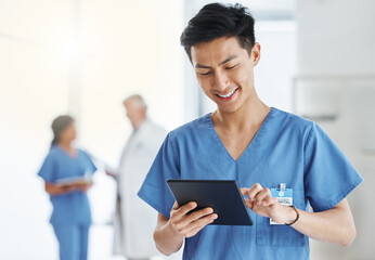 Fototapeta Asian man, smile and nurse with tablet for research, telehealth or healthcare in hospital. Technology, medical professional and male doctor with touchscreen, wellness app and online consultation. obraz