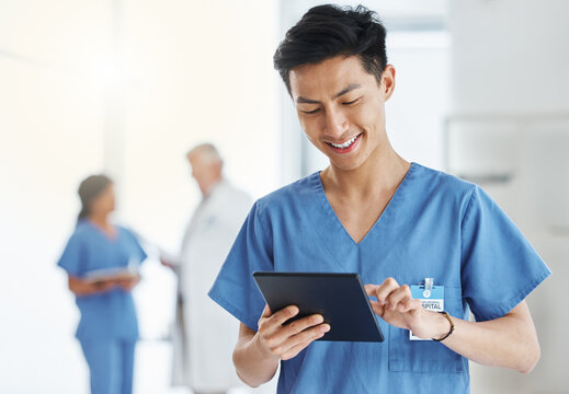 Asian man, smile and nurse with tablet for research, telehealth or healthcare in hospital. Technology, medical professional and male doctor with touchscreen, wellness app and online consultation.