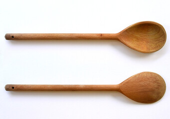 Kitchen wooden spoon on a white background, front view, back view