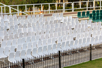 white empty seats on a tribune at daytime