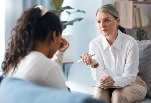 Woman, Therapist And Consulting Sad Patient In Counseling, Mental Health Or Psychology For Healthcare. Female Person Or Psychologist Talking To Client With Anxiety Or Stress In Therapy Consultation