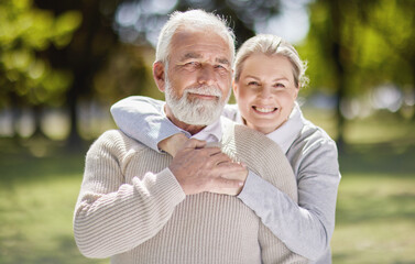 Old couple hug in park with love and smile in portrait, retirement together with trust and support...